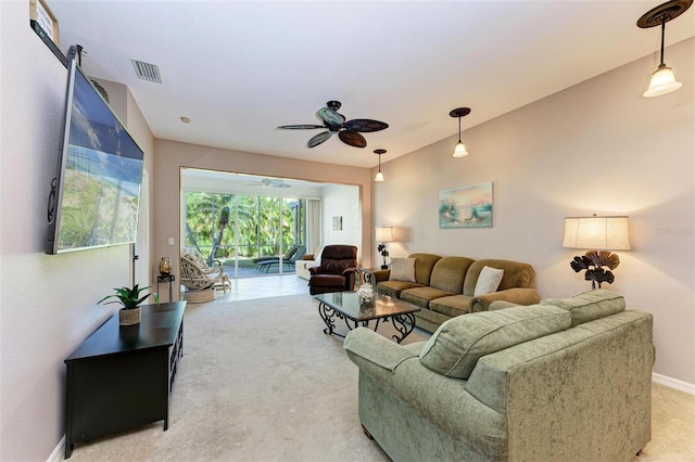 carpeted living room featuring ceiling fan