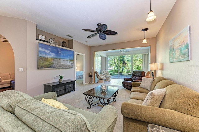 living room with light carpet and ceiling fan