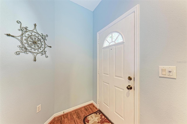 entryway with hardwood / wood-style flooring