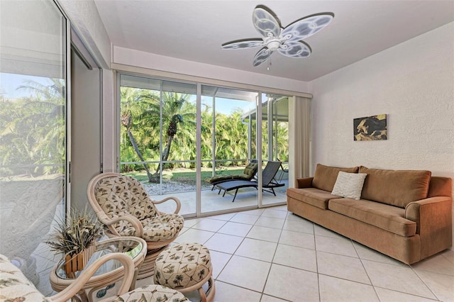 tiled living room with ceiling fan