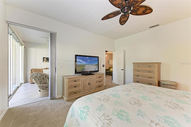 bedroom featuring ceiling fan and light carpet