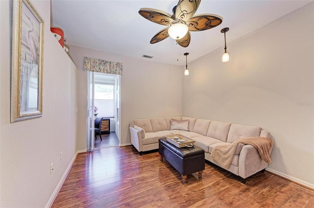 living room featuring ceiling fan, dark hardwood / wood-style flooring, and lofted ceiling