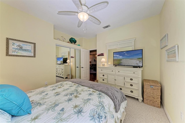 bedroom with light carpet, a closet, and ceiling fan