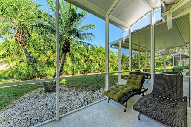 sunroom / solarium with vaulted ceiling