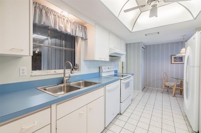 kitchen with white appliances, ceiling fan, sink, light tile patterned floors, and white cabinets