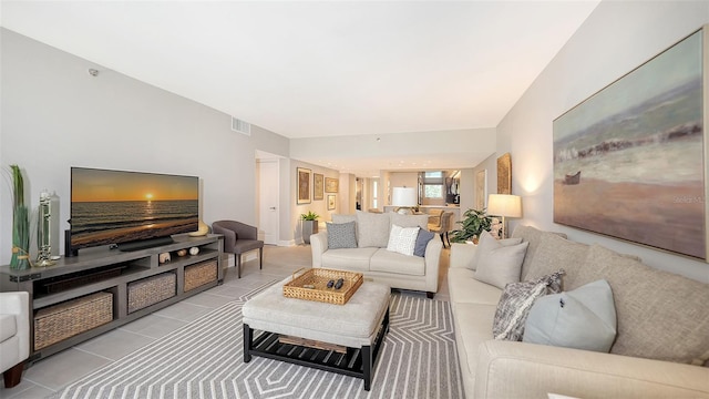 living room with light tile patterned flooring