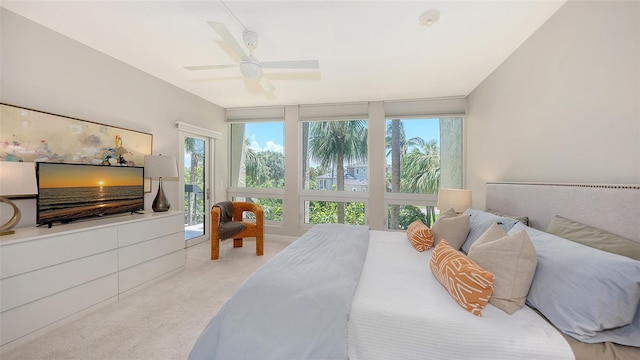 carpeted bedroom with access to exterior and ceiling fan