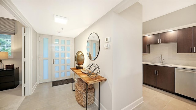 tiled entrance foyer featuring sink