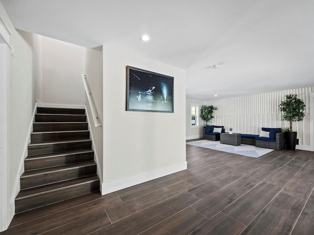 stairs featuring hardwood / wood-style flooring