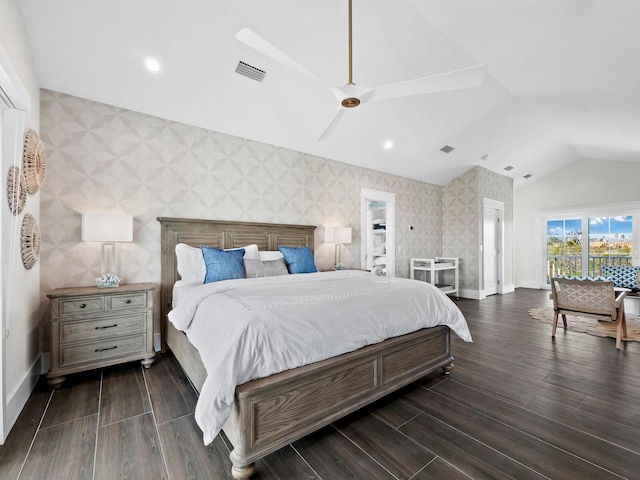 bedroom featuring dark wood-type flooring and vaulted ceiling