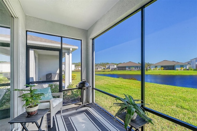 sunroom with a water view