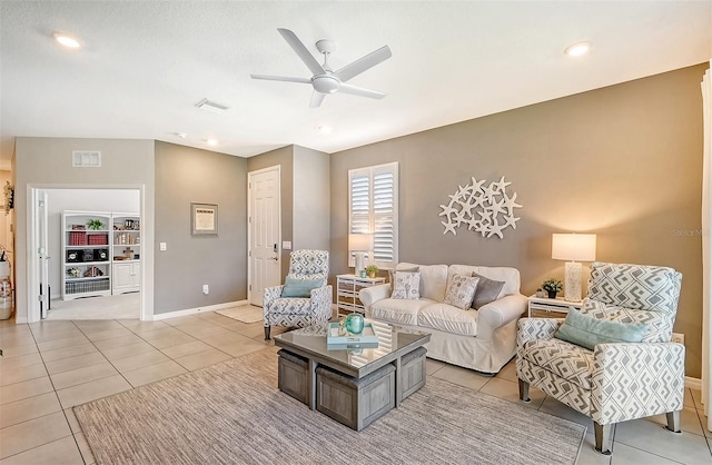 tiled living room featuring ceiling fan