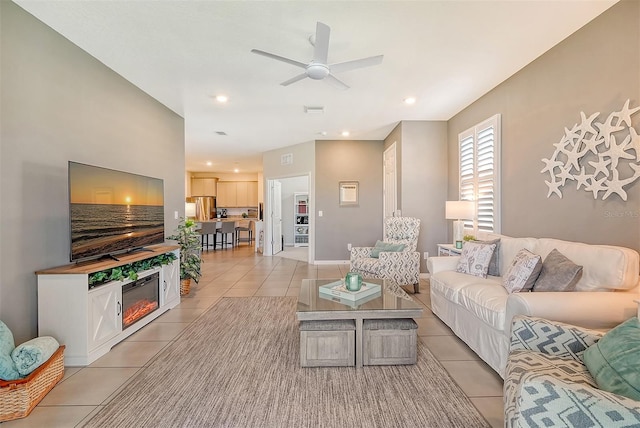 tiled living room featuring ceiling fan