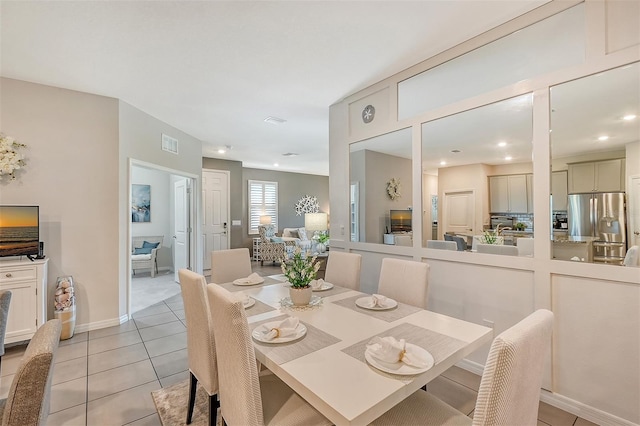 dining space with light tile patterned floors