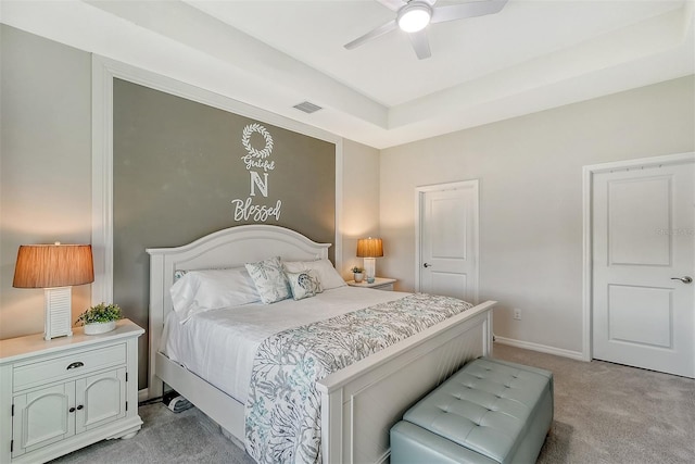 bedroom with ceiling fan and light colored carpet