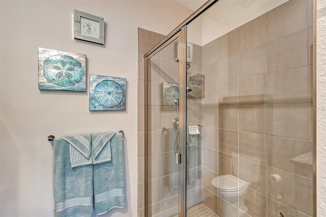 bathroom with toilet and walk in shower