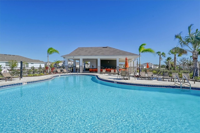 view of swimming pool featuring a patio area