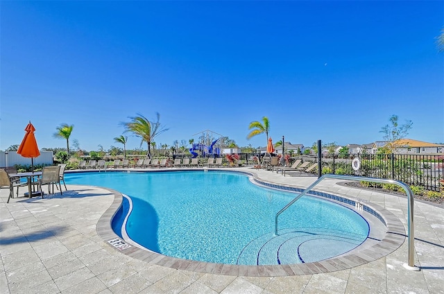 view of swimming pool with a patio