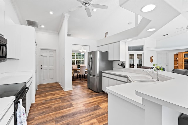 kitchen featuring ceiling fan with notable chandelier, dark hardwood / wood-style floors, white cabinetry, and black appliances