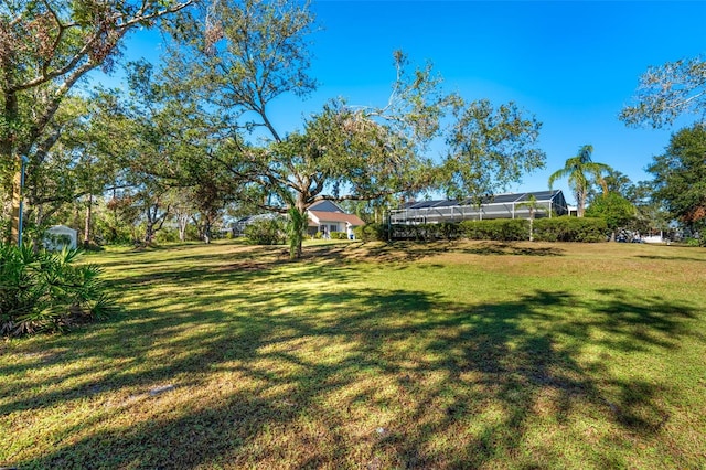 view of yard with a lanai