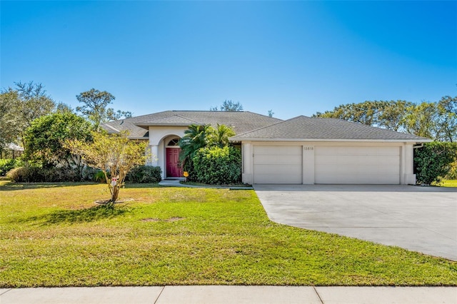 view of front facade with a garage and a front lawn