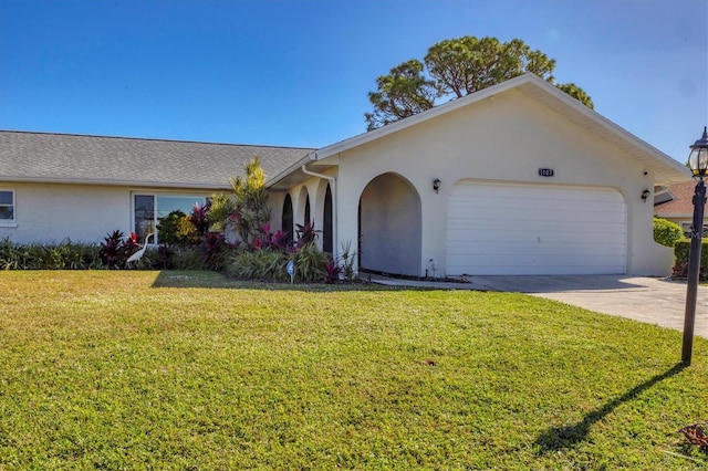 ranch-style home with a garage and a front yard