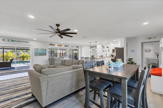 living room with hardwood / wood-style flooring and ceiling fan