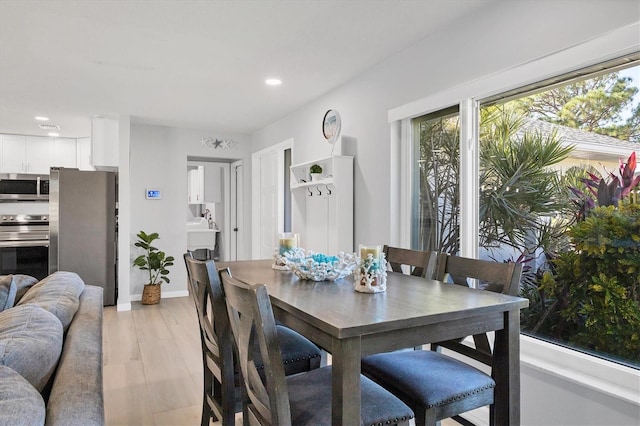 dining room with light wood-type flooring