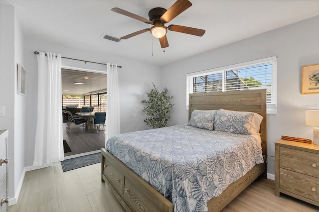 bedroom featuring ceiling fan and light wood-type flooring