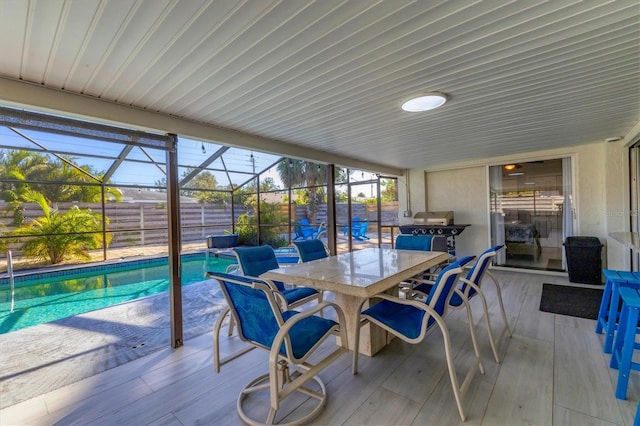 sunroom with a swimming pool