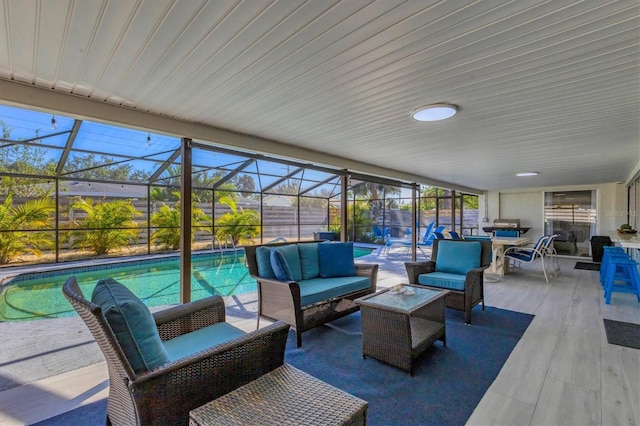 view of patio featuring an outdoor living space and a lanai