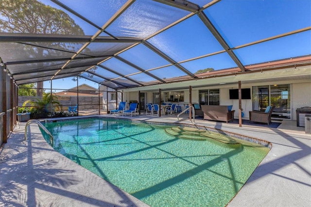 view of swimming pool with an outdoor living space, a lanai, and a patio