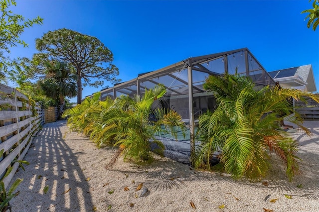 view of side of home featuring a lanai