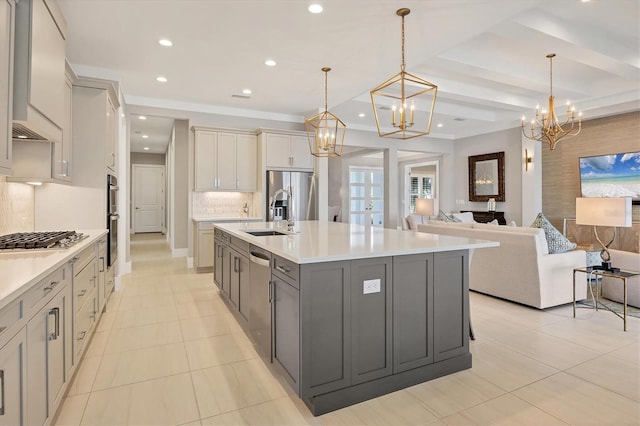 kitchen featuring gray cabinets, a large island, and decorative light fixtures