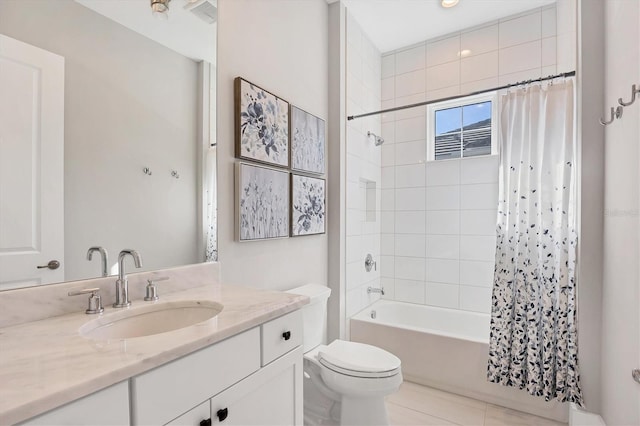 full bathroom featuring toilet, vanity, shower / tub combo with curtain, and tile patterned flooring