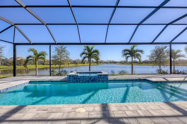 view of pool with glass enclosure, an in ground hot tub, a water view, and a patio