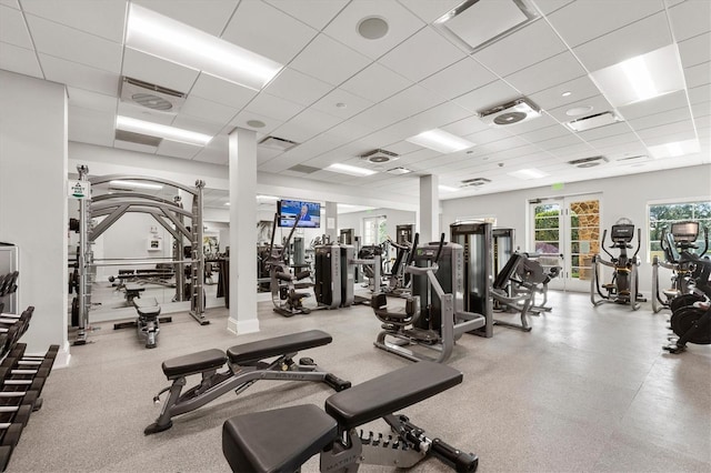 gym featuring a paneled ceiling