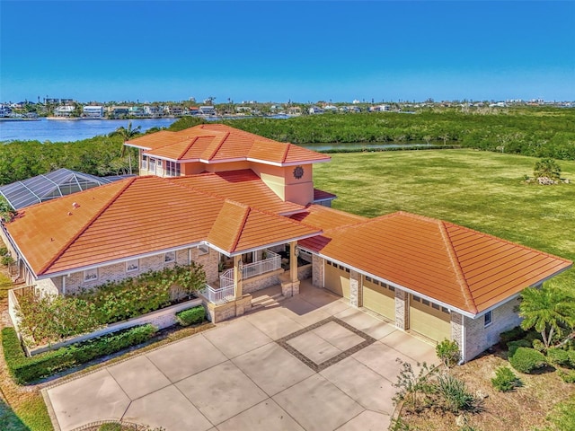 birds eye view of property with a water view