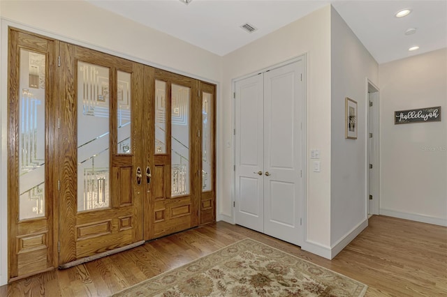 foyer with light wood-type flooring