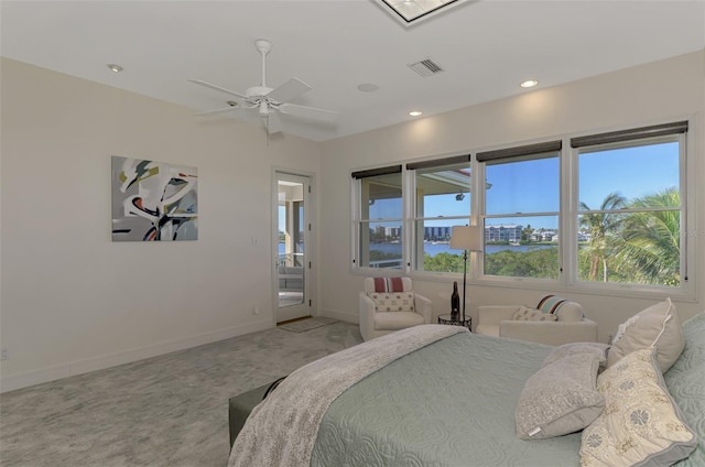 carpeted bedroom featuring access to outside and ceiling fan