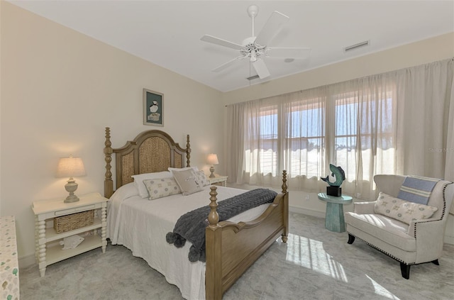 bedroom featuring ceiling fan and light carpet