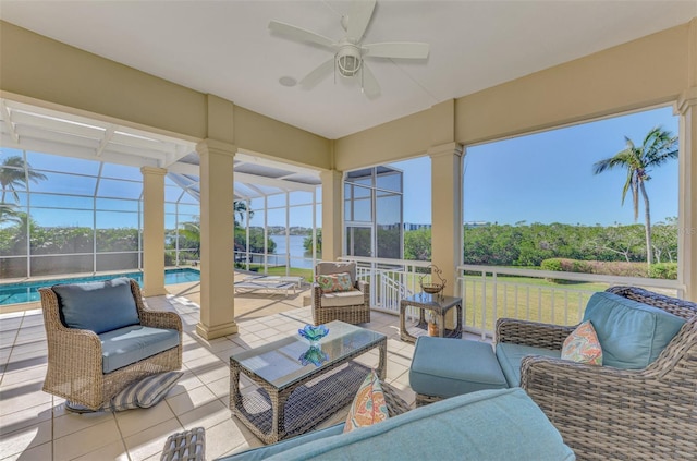 sunroom featuring ceiling fan