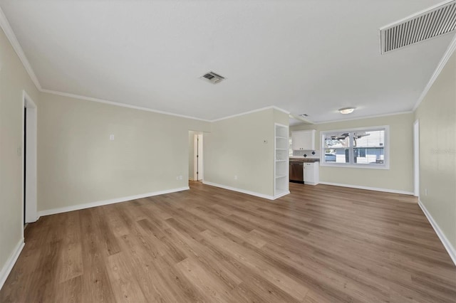 unfurnished living room featuring light hardwood / wood-style flooring and ornamental molding