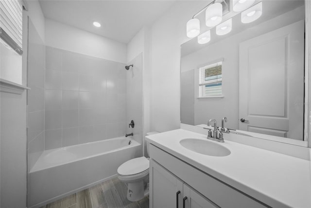 full bathroom with vanity,  shower combination, and toilet