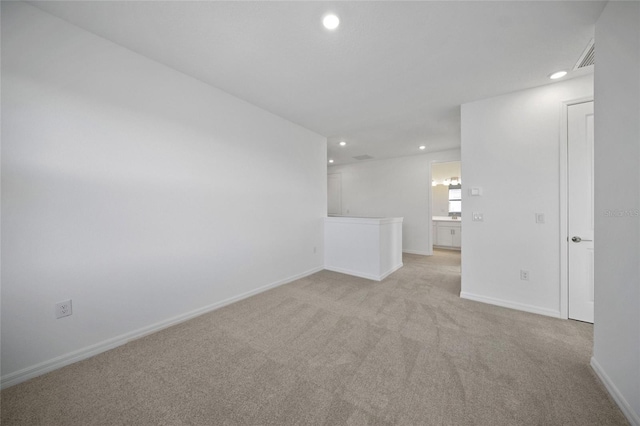 empty room featuring light colored carpet