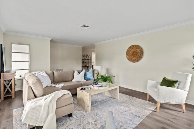 living room with light wood-type flooring and crown molding