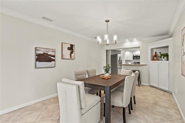 tiled dining space with an inviting chandelier and crown molding