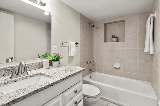 full bathroom with tile patterned floors, vanity, toilet, and tiled shower / bath