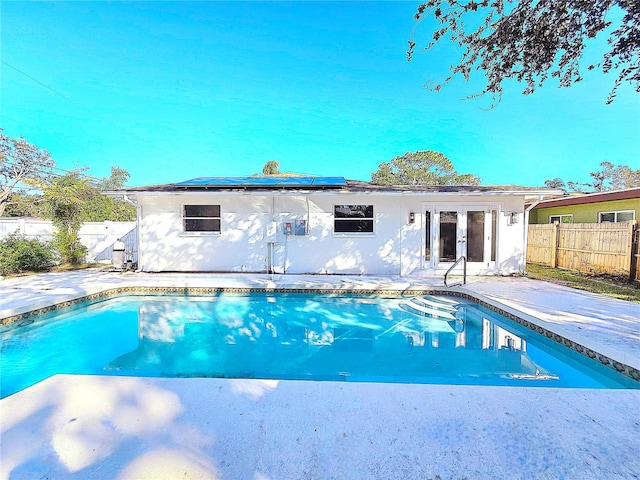 view of pool featuring french doors and a patio