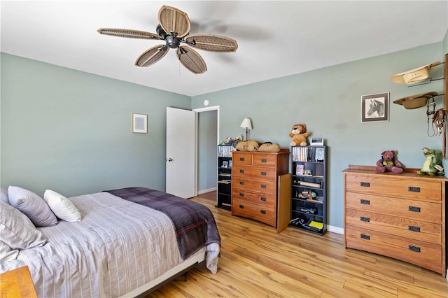 bedroom with ceiling fan and light wood-type flooring